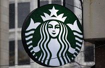 The Starbucks logo is seen, March 14, 2017, on a shop in downtown Pittsburgh.