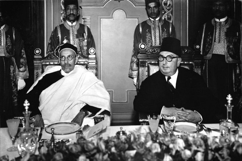 Libya's King Idris El Senussi, left, and Egypt's Prince Abdel Moneim attend a state dinner at the Royal Abdin Palace, in Cairo, December 1952