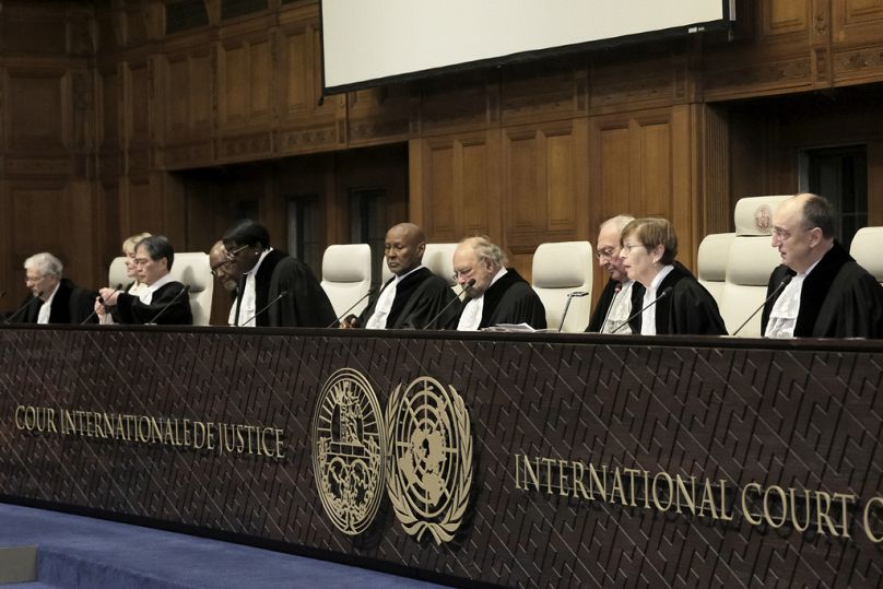 Judges preside over the opening of the hearings at the International Court of Justice in The Hague, Netherlands on Thursday