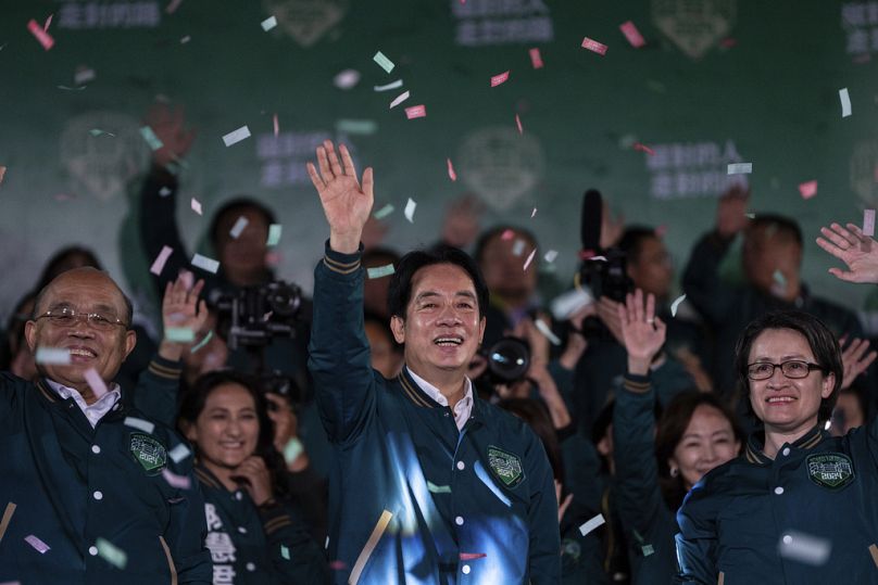 Taiwanese Vice President Lai Ching-te, also known as William Lai, left, celebrates his victory with running mate Bi-khim Hsiao in Taipei, Taiwan on Saturday