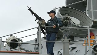 FILE: A sailor stands watch onboard the USS LaBoon as the ship sits docked in Philadelphia, Sunday, March, 16, 2003.