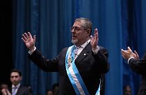 Incoming Guatemalan President Bernardo Arévalo acknowledges the crowd after receiving the presidential sash during his swearing-in ceremony in Guatemala City.