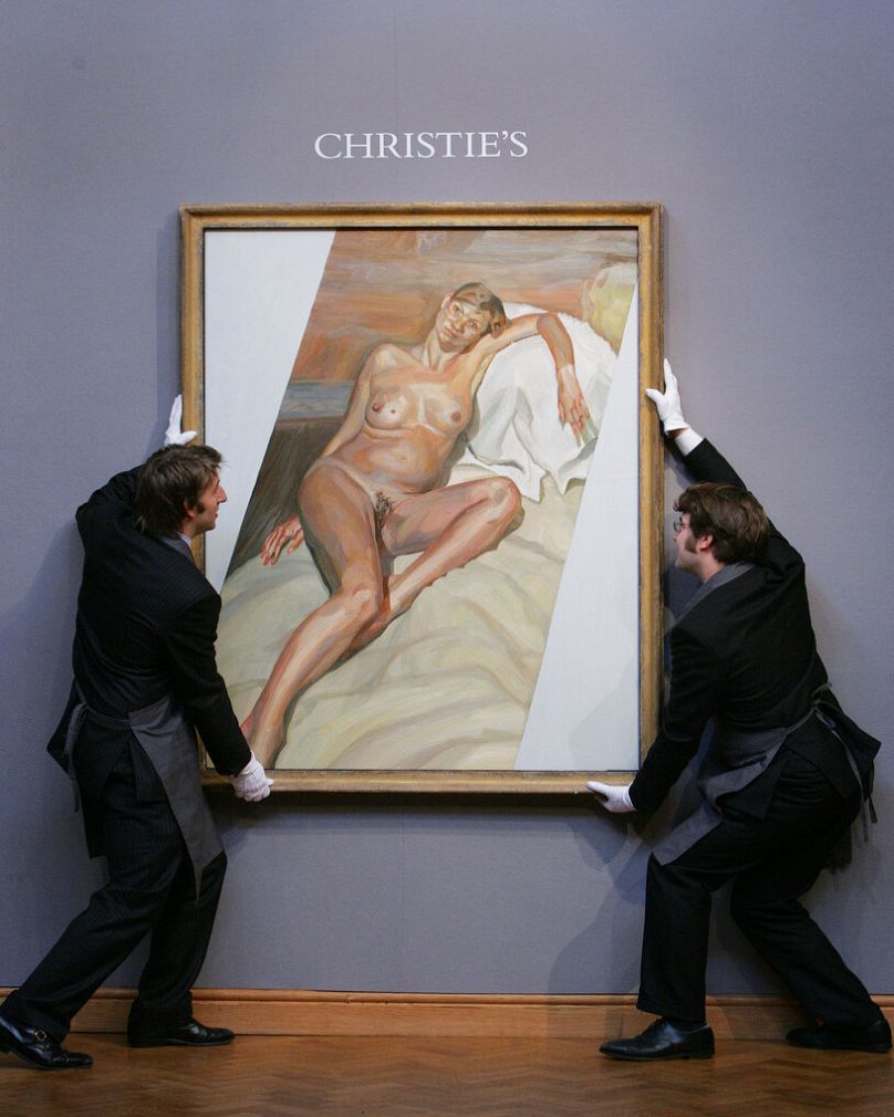 Christie's auctioneers hang a naked portrait of British supermodel Kate Moss painted by Lucian Freud in 2002 at a pre-sale preview in London, Friday, Oct. 29, 2004.