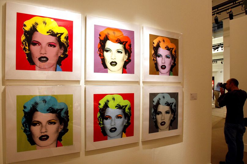 A piece entitled 'Kate Moss' by Banksy is seen on display at Sotheby's auction rooms in London, Monday, Oct. 13, 2008.
