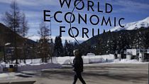 The the logo of the World Economic Forum displayed on a window at the Congress Center in Davos, Switzerland, Sunday, Jan. 14, 2024.