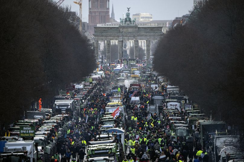Farmers with tractors arrive for a protest at the Brandenburg Gate in Berlin, Germany, Monday, 15 January 2024