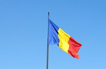 Romanian flag floating in the country's capital city, Bucharest.