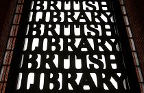 British Library signs are seen over an entrance to the library in London. 