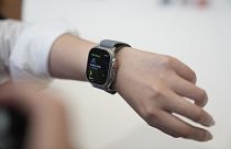A person tries on an Apple Watch during an announcement of new products on the Apple campus.