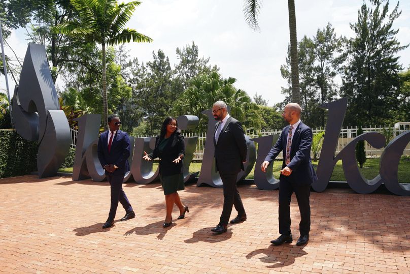Britain's Home Secretary James Cleverly, centre right, visits the Kigali Genocide Memorial in Kigali, Rwanda in December