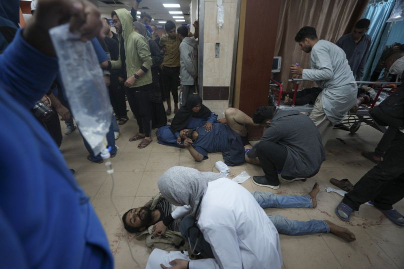 Palestinians wounded in the Israeli bombardment of the Gaza Strip are brought to Al Aqsa hospital in Deir al Balah, Gaza Strip, Sunday, Jan. 7, 2024