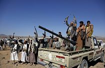 Houthi fighters and tribesmen stage a rally against the U.S. and the U.K. strikes on Houthi-run military sites near Sanaa, Yemen, on Sunday, Jan. 14, 2024. 