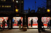 Shoppers visit the Christmas Village in Philadelphia, Dec. 13, 2023. 