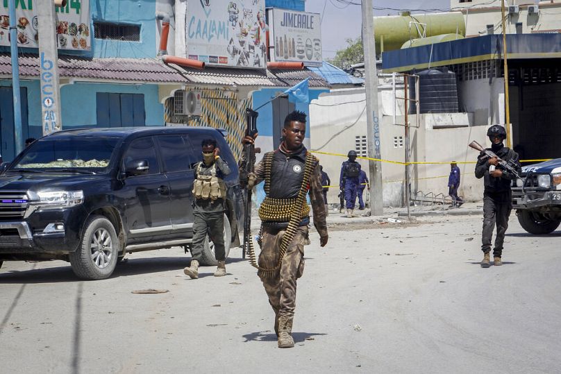 Security forces patrol the scene after gunmen stormed the Hayat Hotel in the capital Mogadishu, August 2022