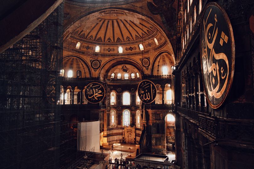 In Hagia Sophia, there is wonder to be found in the soft golden tiles overhead, radiant from the sunlight that streams through the forty small windows under the dome.