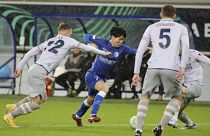 FILE - Istanbul Basaksehir's Eden Karzev, left, fights for the ball with Gent's Hyunseok Hong, center, Belgium, Thursday, March 9, 2023. 