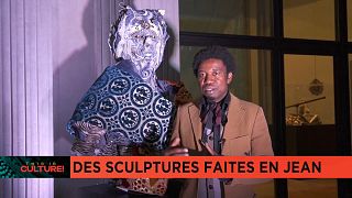 Cameroonian artist Afran showcases collection of sculptures made from denim 