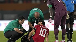Egypt loses Salah to injury in 2-2 Africa Cup draw with Ghana.