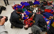 FILE - Demonstrators take part in a lie-in at the Norwegian Parliament in Oslo, Wednesday, Oct. 11 2023.