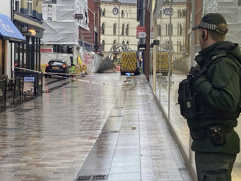 Emergency services at the scene where scaffolding has been dislodged in Belfast City centre, Northern Ireland, during Storm Isha.