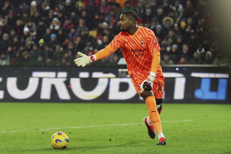AC Milan 's goalkeeper Mike Maignan in action during the Italian Serie A soccer match between Udinese and AC Milan that was suspended, at the Friuli stadium in Udine, Italy.