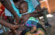 A baby from the Malawi village of Tomali is injected with the world's first vaccine against malaria in a pilot programme, in December 2019.