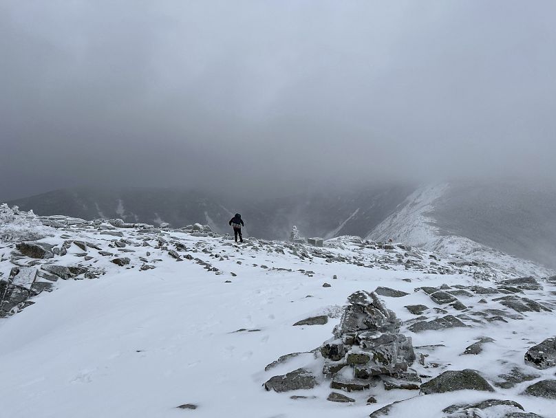 Conservation Officer Christopher McKee stands on Mount Guyot in Grafton County, N.H., during rescue efforts on 17 January 2024 to find hiker Christopher Roma.