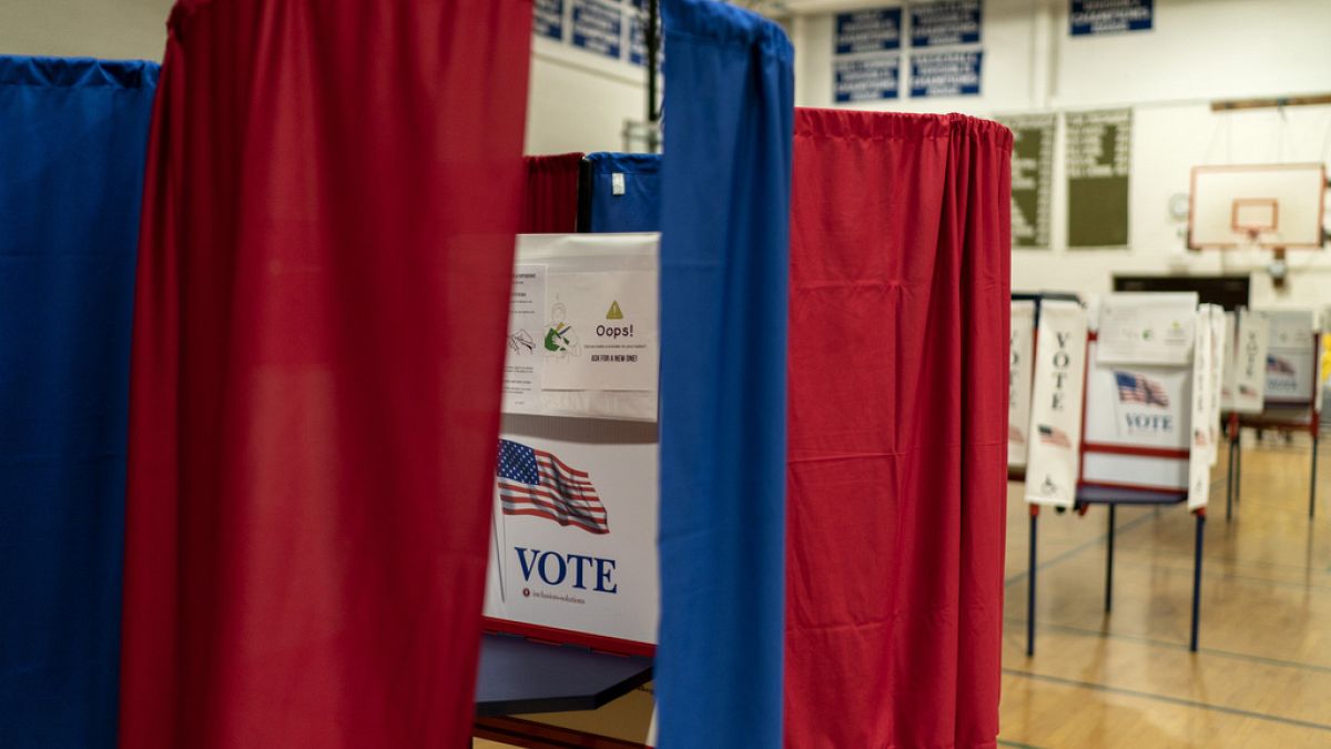 Voting booths are set up in a high school gymnasium in Hollis, N.H., Monday, Jan. 22, 2024