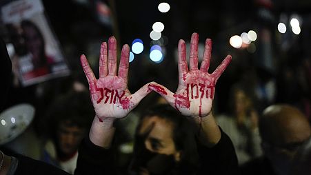 Relatives and supporters of the Israeli hostages held in the Gaza Strip by the Hamas militant group attend a protest calling for their release outside Israel's parliament 22/1