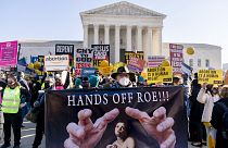 Abortion rights advocates and anti-abortion protesters demonstrate in front of the U.S. Supreme Court, Dec. 1, 2021, in Washington.