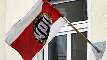A party flag is seen on the façade of the then headquarters of the German right wing party NPD in Berlin, Germany, Thursday, Feb. 7, 2008.