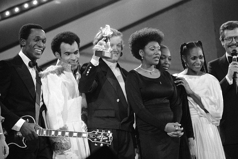 German record producer and songwriter Frank Farian, center, surrounded by members of Boney M - 1985