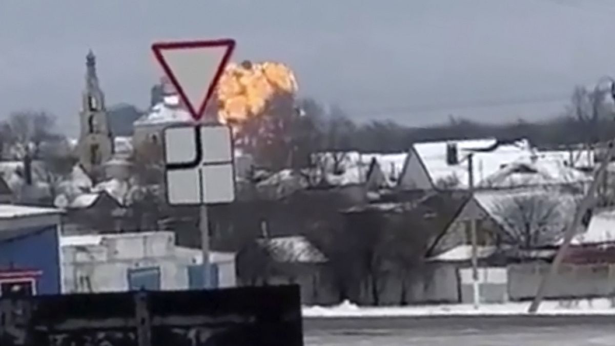 In this handout photo taken from validated UGC video show flames rising from the scene of a warplane crashed at a residential area near Yablonovo, Belgorod region, Wednesday, 