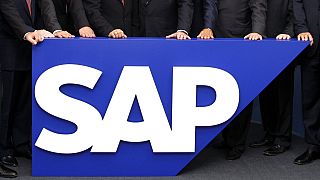 In this July 31, 2008 file picture the board members of German software company SAP are seen behind the company logo at it's headquarter in Walldorf near Heidelberg.