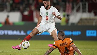 Ivory Coast edges into Africa Cup last 16 despite firing its coach. Morocco's win boosts host nation