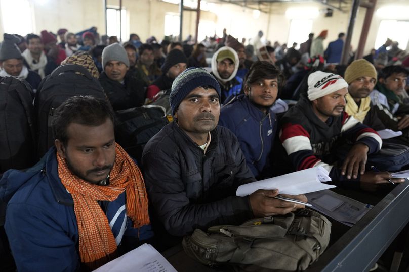 Indian workers aspiring to be hired for jobs in Israel wait to submit their forms during a recruitment drive in Lucknow, India, Thursday, Jan. 25, 2024.