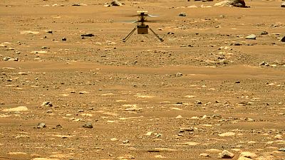The Mars Ingenuity helicopter hovers above the surface of the planet during its second flight on April 22, 2021.