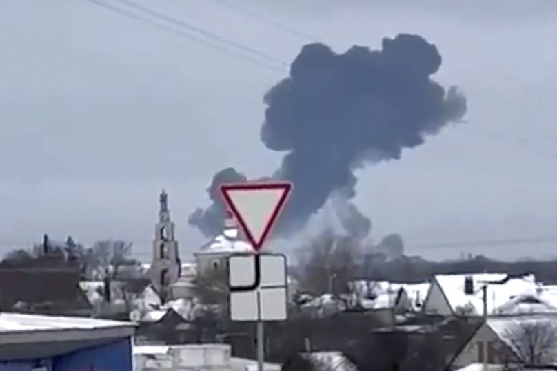 In this photo taken from validated UGC video smoke rises from the scene of a warplane crash at a residential area near Yablonovo, Belgorod region on Wednesday