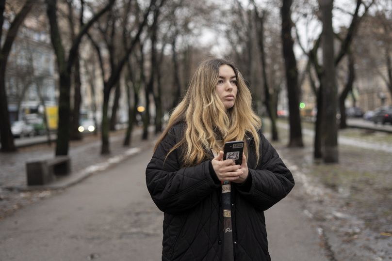 Yevheniia Synelnyk, whose brother has been in captivity for over a year and a half, stands in park in Kyiv, Ukraine, Thursday, Jan. 25, 2024.