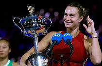 Aryna Sabalenka of Belarus holds the Daphne Akhurst Memorial Cup after winning Australian Open, 27 January 2024