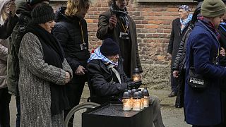 Survivors and their companions at the Auschwitz Nazi death camp in Oswiecim, Poland on Jan. 27, 2024.