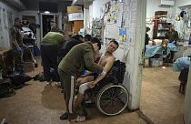 Military medics give first aid to wounded Ukrainian soldiers at a medical stabilization point near Bakhmut, Donetsk region in Ukraine