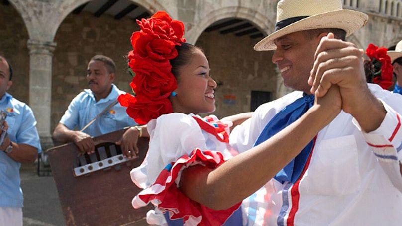 Learn the steps of merengue and bachata.