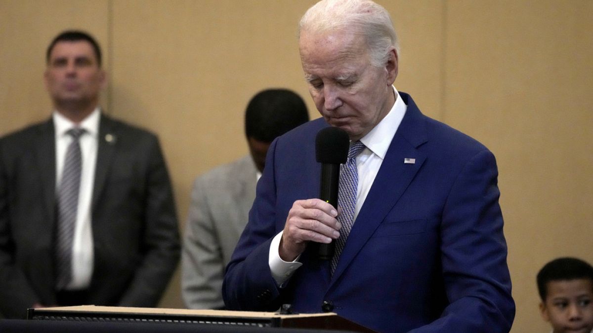 President Joe Biden bows his head in a moment of silence for the three American troops killed Sunday, Jan. 28, 2024