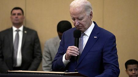 President Joe Biden bows his head in a moment of silence for the three American troops killed Sunday, Jan. 28, 2024