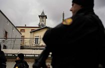Turkish police officers stand guard in a cordoned off area outside the Santa Maria church, in Istanbul, Turkey, Sunday, Jan. 28, 2024. 