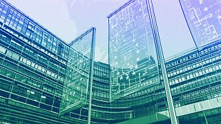 European Commission building with EU AI Act flags, illustration