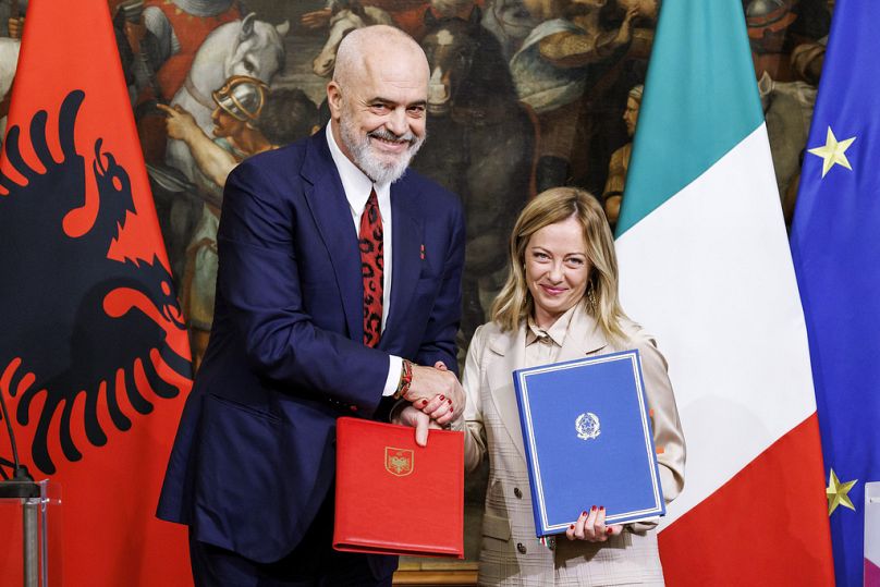 Italy's PM Giorgia Meloni and Albania's PM Edi Rama shake hands after the signing of a memorandum of understanding on migrant management centers, in Rome, November 2023