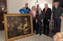  Agent Gary France, Dr. Francis Wood, and Wood's children stand with the recovered John Opie painting stolen in 1969 from Wood's parents' Newark, N.J., home.