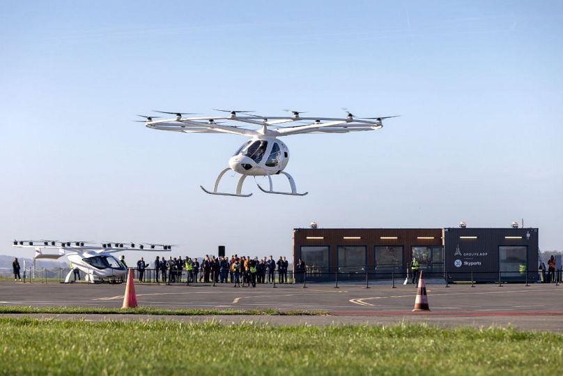 Crewed Volocopter 2x flies in front of ADP and Skyports Vertiport at Pontoise-Cormeille testbed.